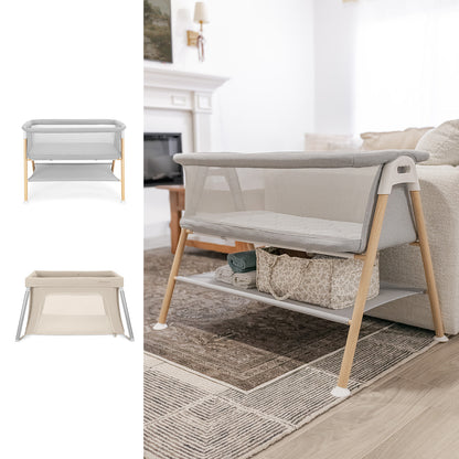 The Newton Baby Essential Bassinet + Compact Travel Crib, featuring mesh sides, a breathable mattress, light wood legs, and handy under-bassinet storage, is displayed in two colors beside a beige sofa in a bright living room.