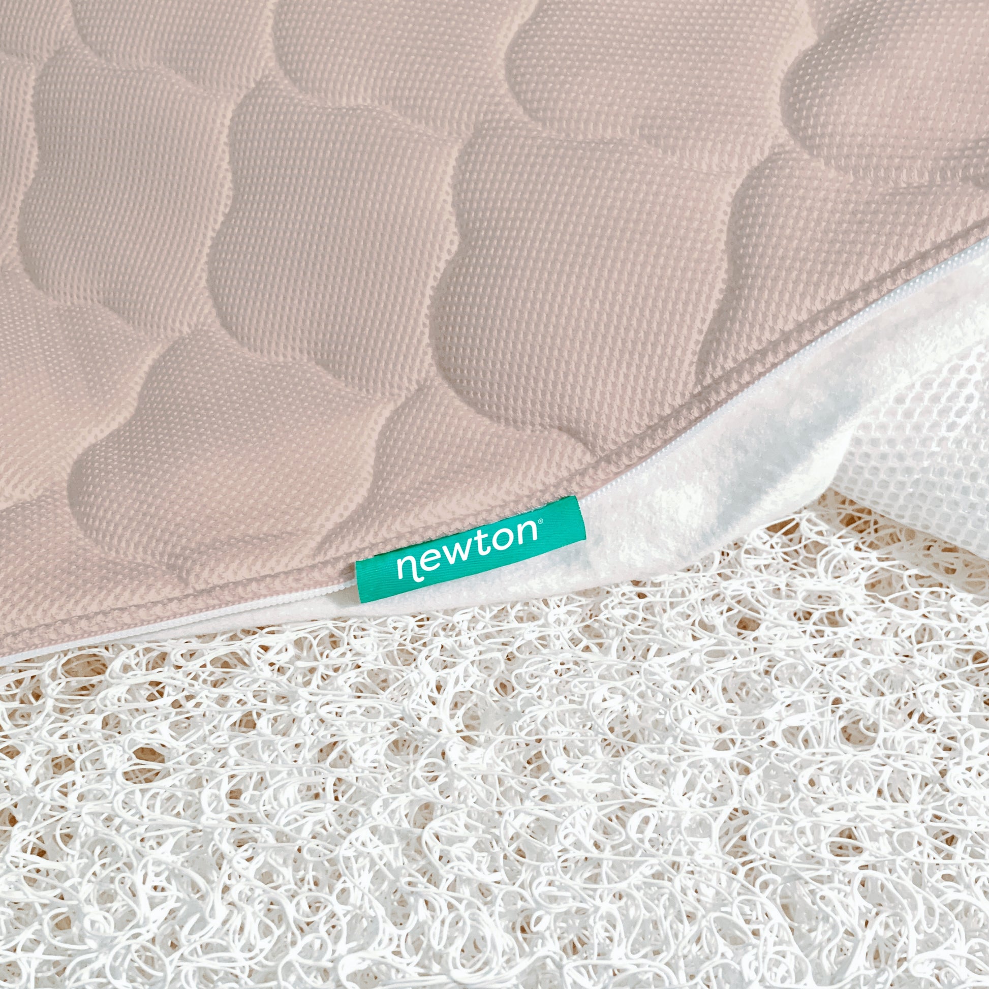 close up of newton mattress cover and innovative newton wovenaire core