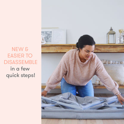 woman folding up newton travel crib and play yard with text "new and easier to disassemble in a few quick steps!"