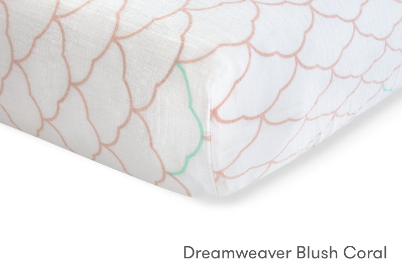 Close-up of a Dreamweaver Blush Coral sheet with delicate coral wave patterns. 999-3020-PDW 999-3520-PDW