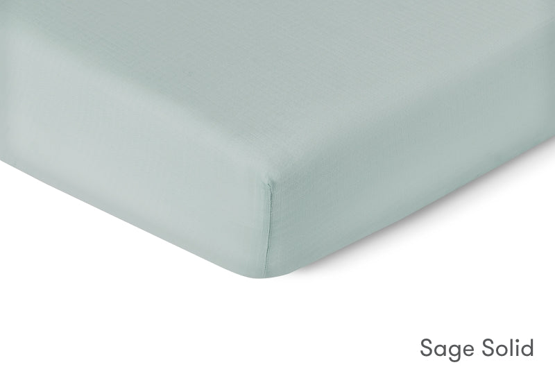 Close-up of a sage solid sheet by Newton Baby. 999-3020-SNS 999-3520-SNS