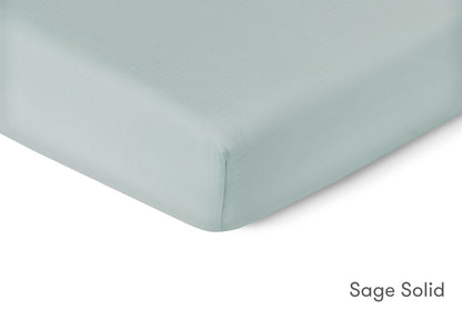 Close-up of a sage solid sheet by Newton Baby. 999-3020-SNS 999-3520-SNS