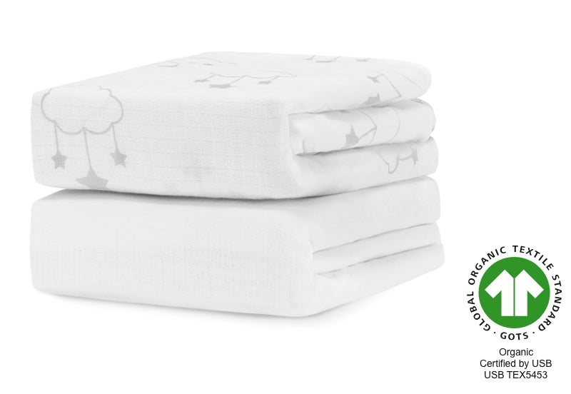 A stack of three organic white baby blankets with cute cloud and star designs, certified by GOTS and USB with certification number USB TEX5453. 999-3020-WSW 999-3520-WSW