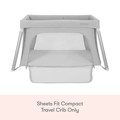 A set of gray Newton Baby Compact Travel Crib Sheets on a light background, with text: Fits compact travel crib sheets or play yard mattress sheets only.