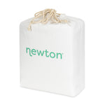 A soft, white drawstring bag with 