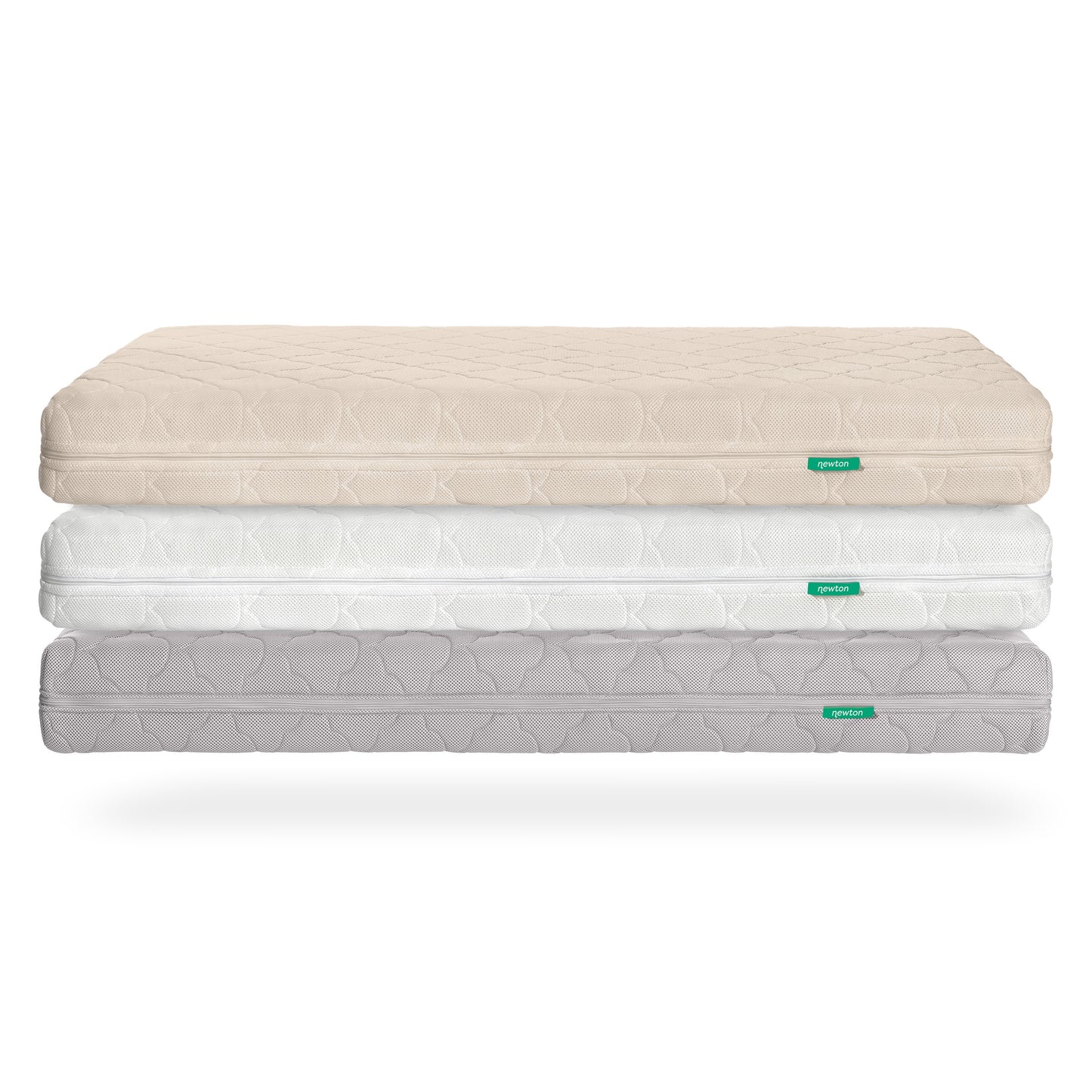 Three stacked Newton Baby Waterproof Crib Mattresses in beige, white, and light gray display a subtle geometric pattern and a green label. Each breathable mattress includes a washable cover, shown against a white background.