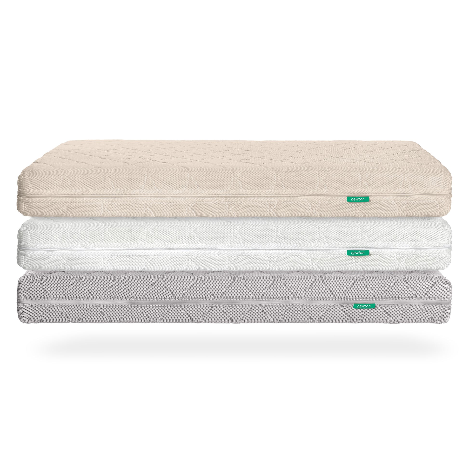 Three stacked Newton Baby Waterproof Crib Mattresses in beige, white, and light gray display a subtle geometric pattern and a green label. Each breathable mattress includes a washable cover, shown against a white background.