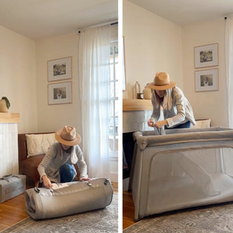 A woman in a hat sets up a portable playpen in a living room, first unrolling it on the floor and then pulling up the sides to assemble it. The room has a fireplace, armchair, and framed art on the wall.