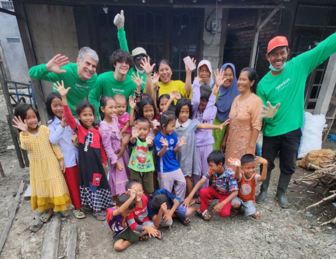 Our Founder and his son Henry visiting one of the villages