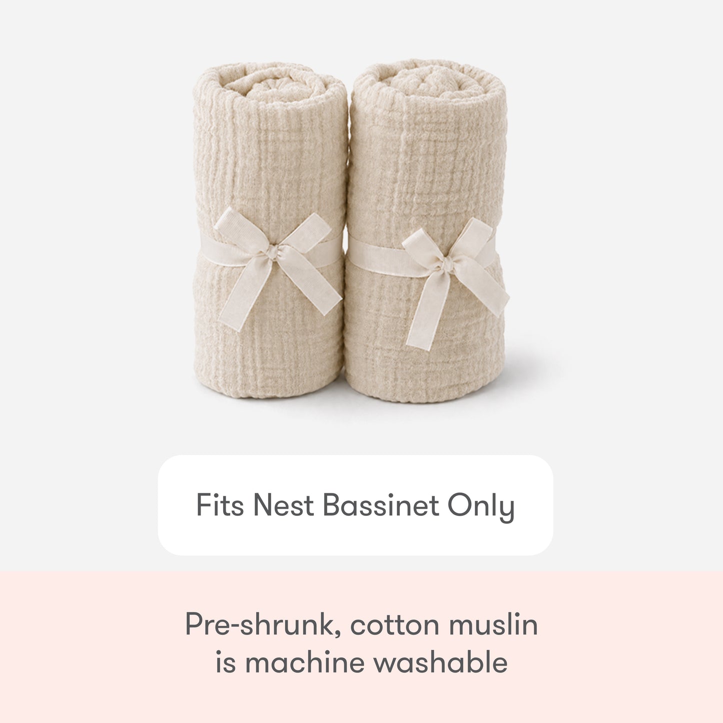 Two rolled cream-colored Newton Baby Nest Bassinet Extra Sheets, each tied with a ribbon, are shown. Text: Fits Nest Bassinet Only. These breathable, pre-shrunk cotton muslin sheets are machine washable.