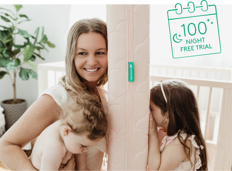 A woman and two children are in a cozy room with a bright pink newton mattress, creating a warm and inviting atmosphere with over the image image label of "100 Night Free Tial"