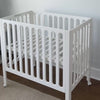Gif of white Galileo Mini with Crib Mattress being added and removed. 