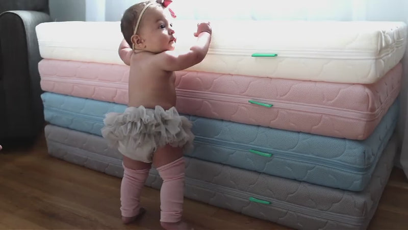 Caucasian Toddler Standing Towards Black Wearing Diapers Stock