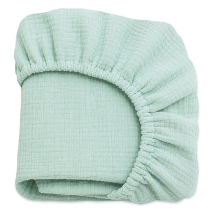 The Newton Baby Breathable, Organic Cotton Sheets (2-pack) feature soft, crinkled textured muslin in light green with elastic edges—perfect, breathable bedding for your baby. 999-3020-MNT