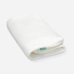 A rolled-up Newton baby mattress cover showing its breathable design, with the Newton logo visible on the edge.