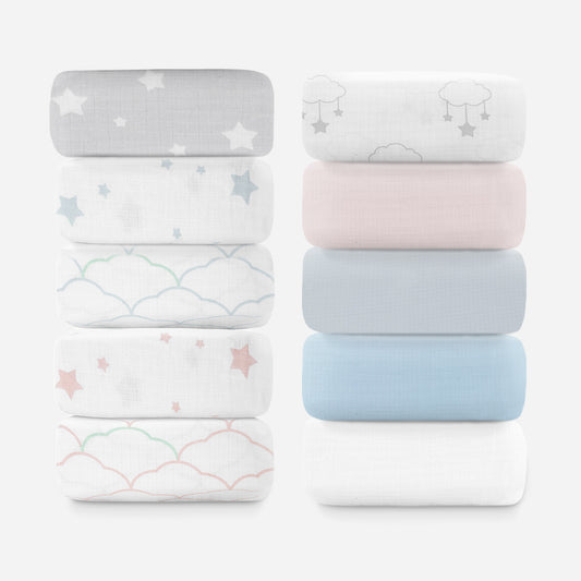 Stack of ten sheets in assorted designs including stars, clouds, and plain colors.