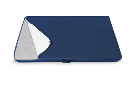 A figgy couch piece with a removable navy cover partially peeled back to reveal the inner material.